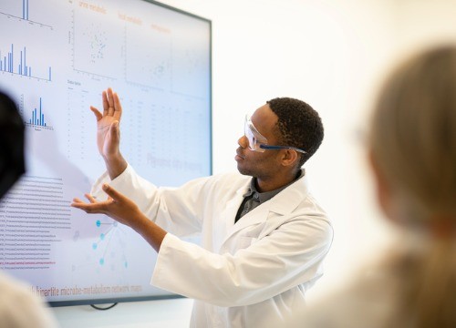 Scientist displaying data on screen