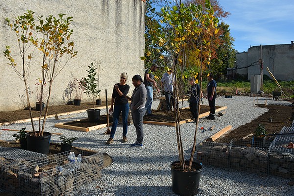Kimberlee Douglass, MLandArch, works with community members to set up small parks as part of a "green network" in Philadelphia.