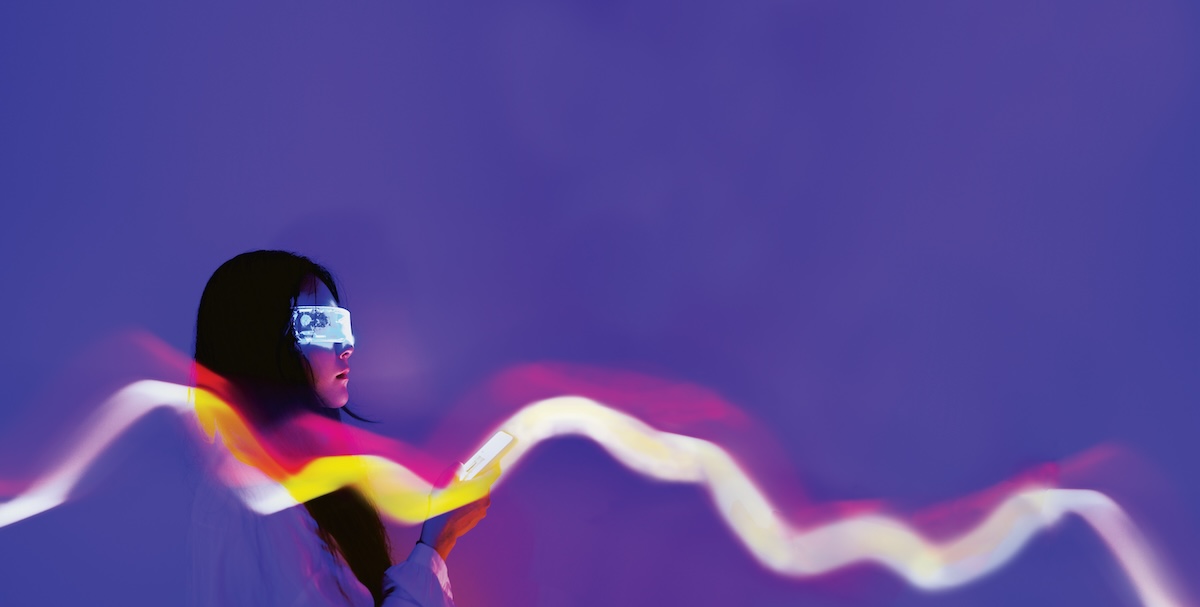 Woman with VR headset holding a phone