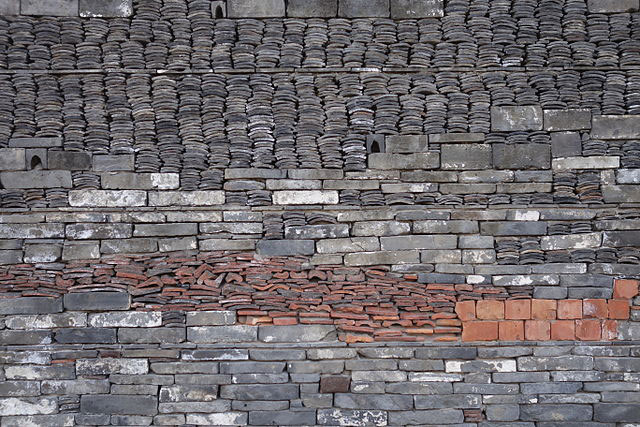 Reclaimed tilework on Wang Shu and Amateur Architecture Studio’s 2008 Ningbo History Museum, constructed from the rubble of the demolished village that once occupied the site, honoring the region’s past through material memory